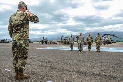 U.S. Army Col. Brian Hughes returns his first salute as the Joint Task Force-Bravo commander during the JTF-Bravo change of command ceremony at Soto Cano Air Base, Honduras, July 7, 2016. Hughes is rated in seven different aircraft, has accumulated more than 2,200 total flying hours, and has earned the Master Aviator Badge. (U.S. Air Force photo by Staff Sgt. Siuta B. Ika)