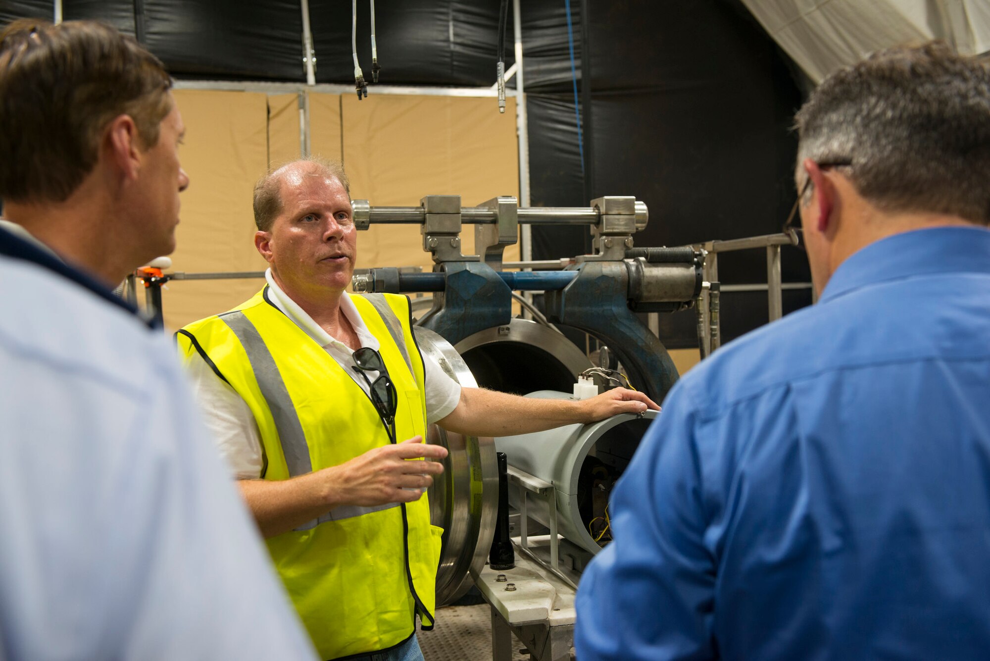 Derek Romitti gives Joint Base McGuire-Dix-Lakehurst leaders a tour of the Explosive Destruction System on July 7, 2016, at JB MDL Lakehurst. RCMD officials will use the ECD to destroy two World War I era chemical munitions that were discovered at JB MDL Lakehurst late last year. Romitti is the U.S. Army Chemical Materials Activity's Recovered Chemical Materiel Directorate's EDS project manager. (U.S. Air Force photo by Senior Airman Joshua King/Released) 