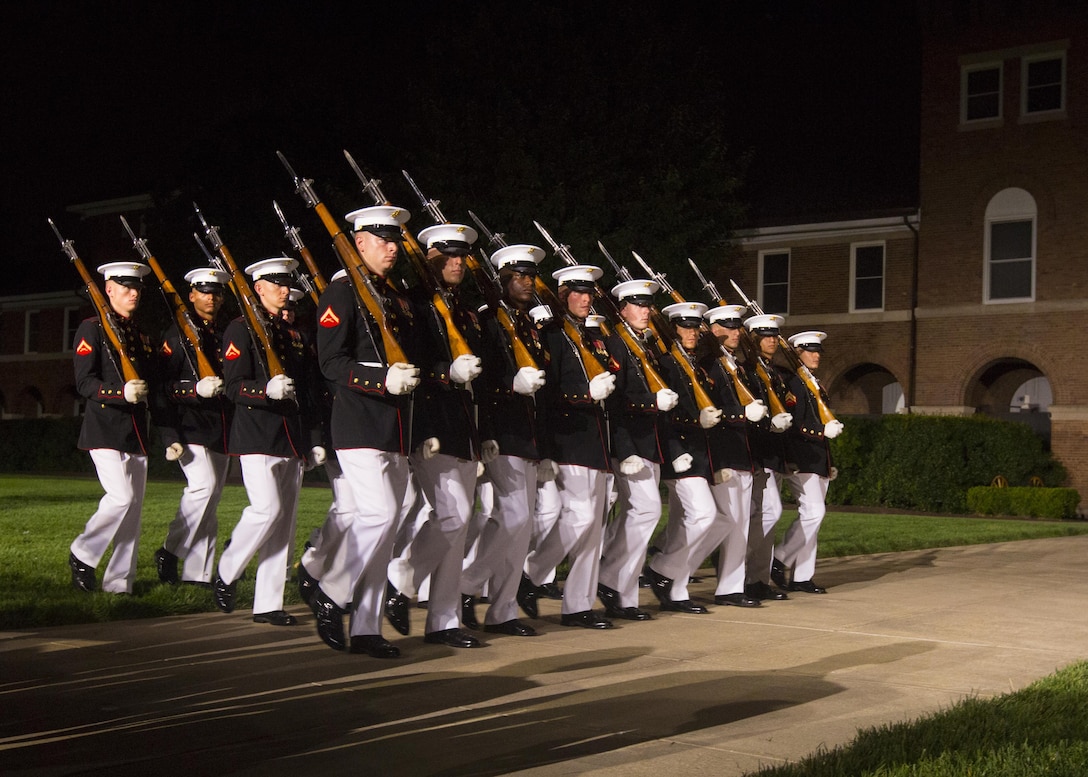 The United States Marine Corps Silent Drill Platoon performs during the Evening Parade at Marine Barracks Washington, D.C., July 8, 2016. The guests of honor for the parade were Mr. Christian Brose, majority staff director, U.S. Senate Armed Services Committee, the Honorable Elizabeth L. King, minority staff director, U.S. Senate Armed Services Committee, Mr. Robert L. Simmons, majority staff director, U.S. House Armed Services Committee and Mr. Paul Arcangeli, minority staff director, U.S. House Armed Services Committee. The hosting official was Lt. Gen. Kenneth McKenzie Jr., director, J-5, Strategic Plans and Policy, Joint Staff. (Official Marine Corps photo by Lance Cpl. Robert Knapp/Released)