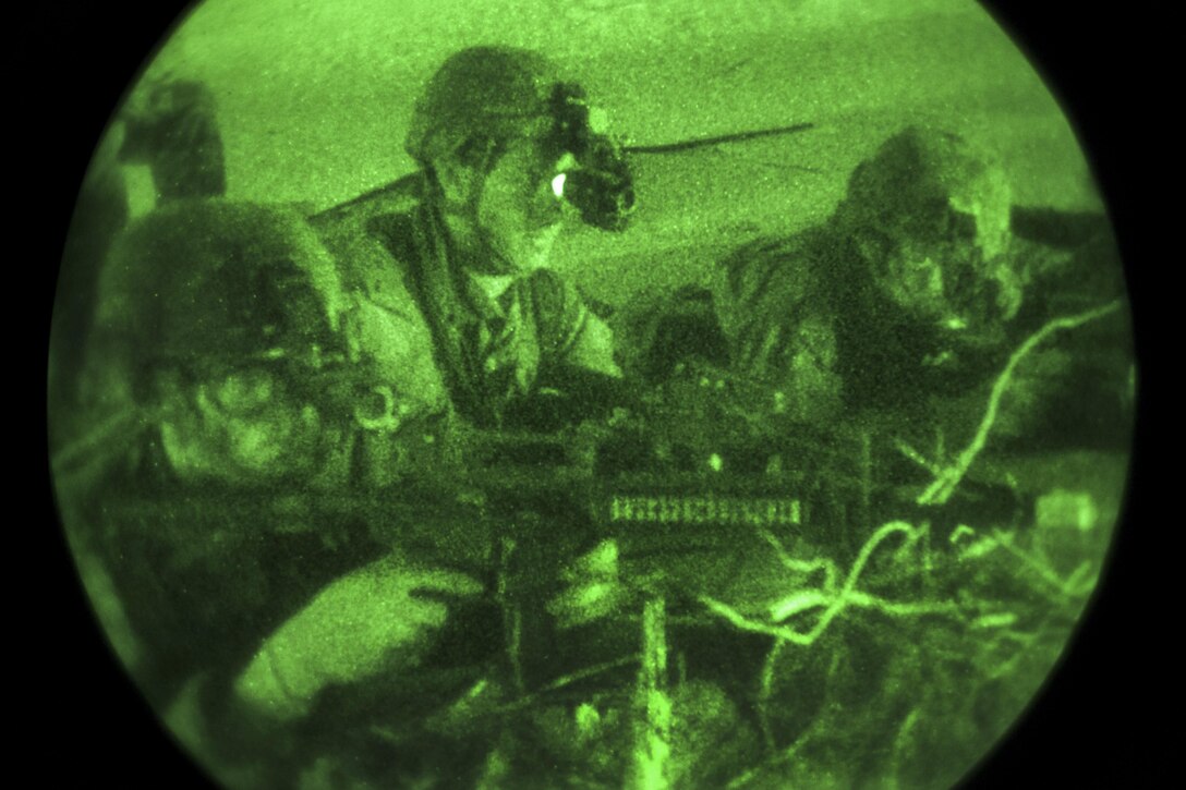 Soldiers look through their night-vision goggles as they prepare to assault their objective on Santa Rosa Island near Eglin Air Force Base, Fla., July 8, 2016. The soldiers are Army Ranger students assigned to the Airborne and Ranger Training Brigade. The Florida Phase of Ranger School is the third and final phase that these Ranger students must complete to earn the Ranger Tab. Army photo by Sgt. Austin Berner