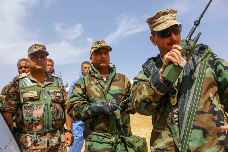 U.S. Marine Chief Warrant Officer 3 Clinton Myrick with Chemical Biological Radiological Nuclear (CBRN), 2nd Marine Division, and members of the Jordanian Armed Forces participate in a CBRN demonstration during Exercise Eager Lion 16 outside of Amman, Kingdom of Jordan on May 18, 2016. Eager Lion 16 is a US military bi-lateral exercise with the Hashemite Kingdom of Jordan designed to strengthen relationships and interoperability between partner nations. (U.S. Marine Corps photo by Cpl. Lauren Falk 5th MEB COMCAM/Released)