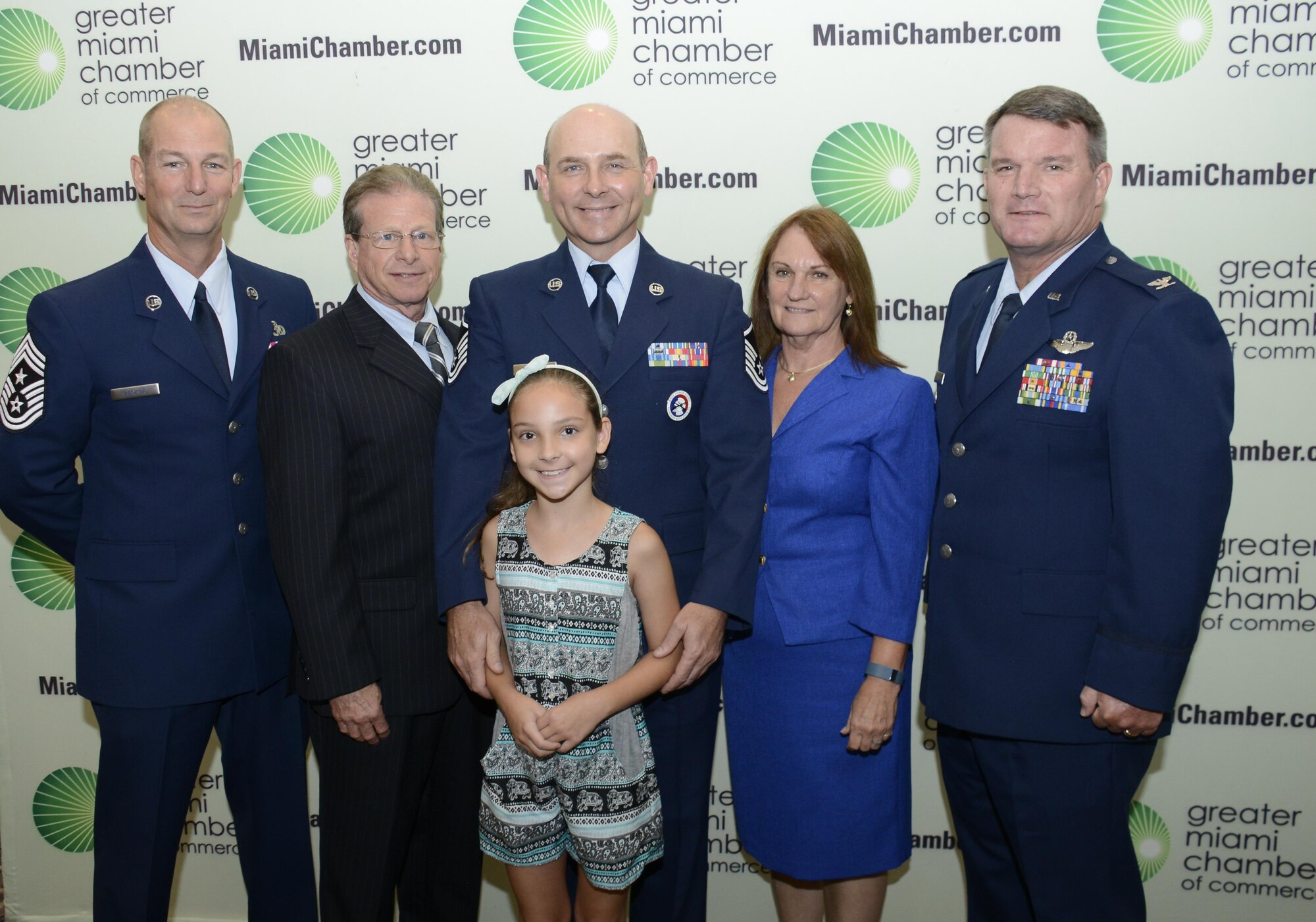 From left, Chief Master Sgt. Frederick Becking, the 482nd Fighter Wing command chief, Corey Gold, the 482nd Medical Group honorary commander, Master Sgt. Frank Navarro, the 482nd FW Honor Guard superintendent, his daughter Emily, Sharon Haxton, the 482nd FW honorary commander and Col. Gregory Lee, the 482nd FW director of staff, pose for a photo at the Greater Miami chamber of Commerce during their 29th Annual Awards Program and Salute to the Military, in Miami, Fla. July 7. Navarro was selected by the chamber as a military service person of the Year. He was one of nine other servicemembers selected by the chamber for their service to their communities. 