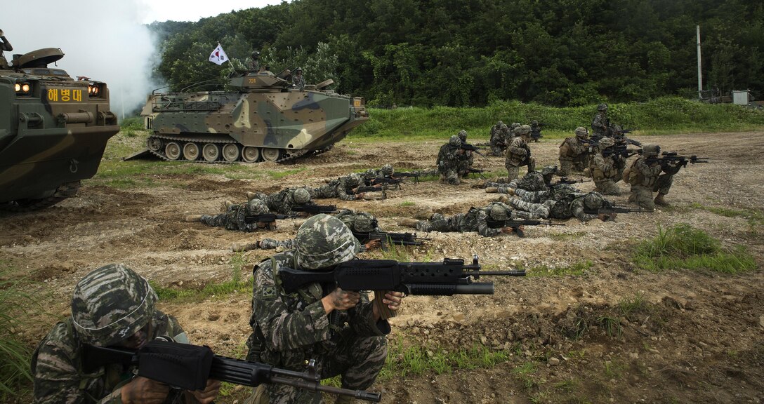 U.S. and Republic of Korea Marines sight in side-by-side in front of ROK Assault Amphibious Vehicles July 6, 2016 at Suseong Range, South Korea, during a Korean Marine Exchange Program. The goal of the KMEP is to sustain the combined force and enhance the ROK-U.S. team at the tactical level to build combined warfighting capabilities. During this exercise the Marines carried out a bilateral regimental-sized Marine Air Ground Task Force operation for the first time. The ROK Marines were a part of 73rd Battalion, 7th Regiment, 1st Marine Division. The U.S. service members are a part of 2nd platoon, Fox Company, 2nd Battalion, 2nd Marine Regiment, currently attached to 4th Marine Regiment, III Marine Expeditionary Force through the unit deployment program. (U.S. Marine Corps photo by Lance Cpl. Amaia Unanue/ Released)