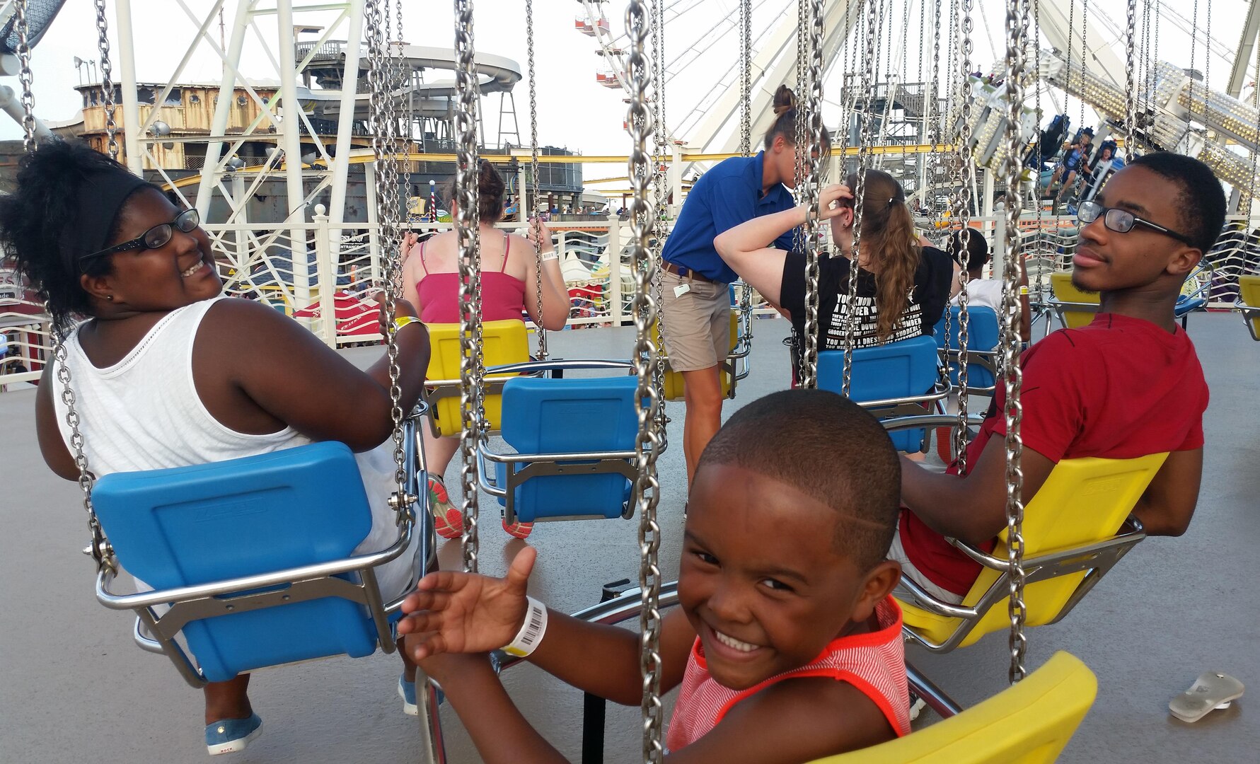 Malaysia, E.J. and Treyvon are ready to swing on the boardwalk in Wildwood, New Jersey during DLA Troop Support’s Family Day July 7. Thousands of employees and their guests spent the day at water parks and on amusement rides during the annual gathering.