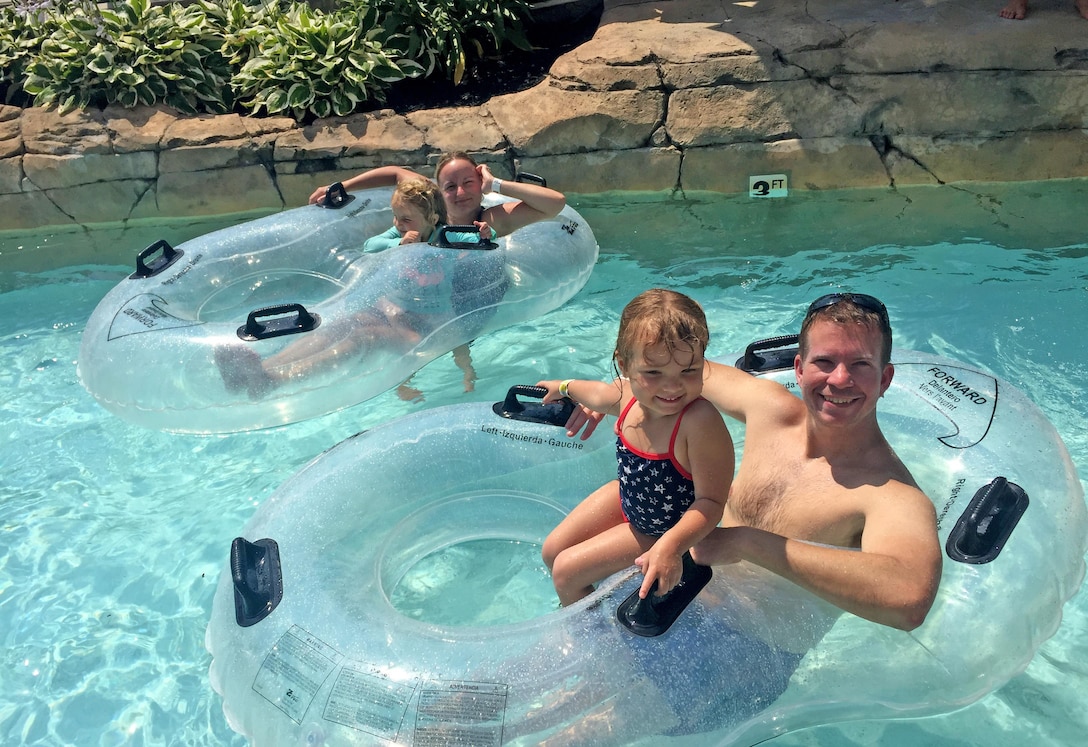 Mike Tuttle, public affairs specialist, and his daughter, Sara, 3, ride the lazy river in Wildwood, New Jersey during DLA Troop Support’s Family Day July 7. Thousands of employees and their guests spent the day at water parks and on amusement rides during the annual gathering.