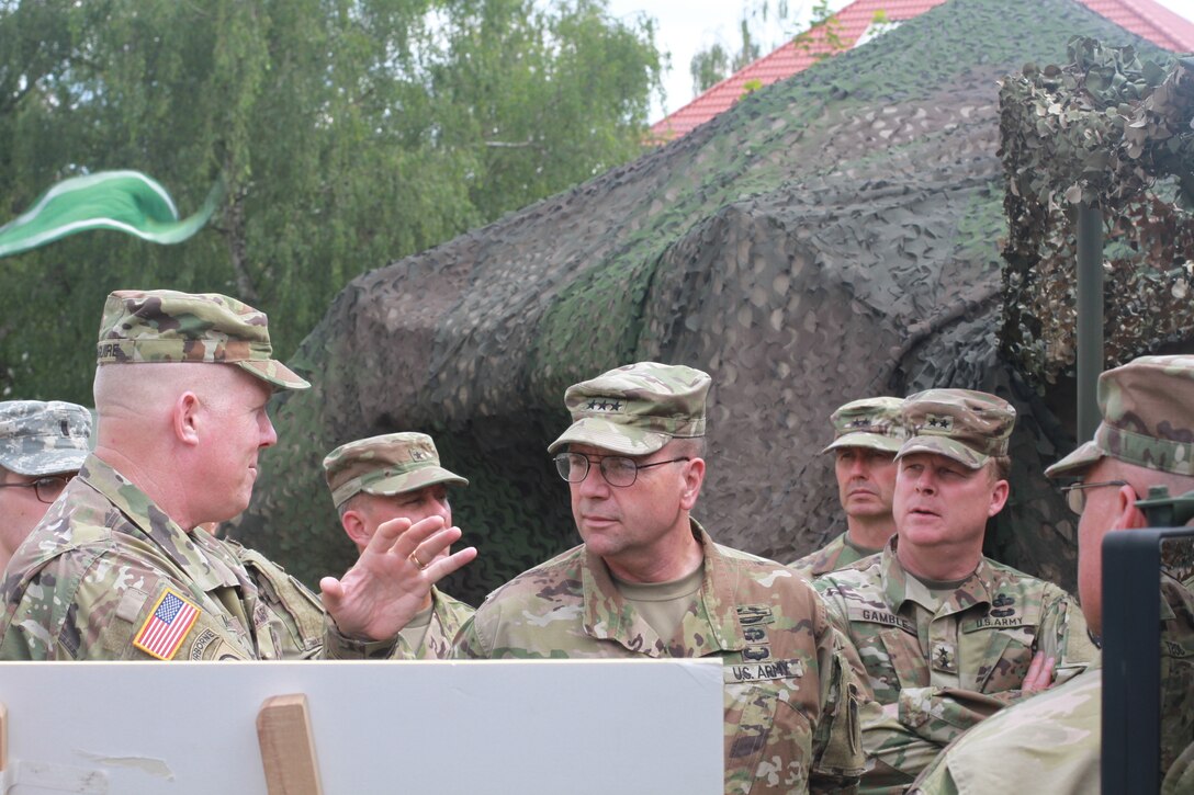 KAISERSLAUTERN, Germany- Lt. Gen. Frederick B. Hodges, Commander U.S. Army Europe, Maj. Gen. Duane Gamble, commanding general of the 21st Theater Sustainment Command, and Maj. Gen. David Conboy, the deputy commanding general - operations from the United States Army Reserve Command listen to a briefing during a visit to Daenner Kaserne on July 9, 2016. Hodges emphasized the U.S. Army and Army Reserve's strategic role in Europe against both conventional and unconventional threats. (U.S. Army photo by Sgt. Daniel J. Friedberg, 7th Mission Support Command Public Affairs Office)