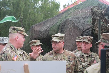 KAISERSLAUTERN, Germany- Lt. Gen. Frederick B. Hodges, Commander U.S. Army Europe, Maj. Gen. Duane Gamble, commanding general of the 21st Theater Sustainment Command, and Maj. Gen. David Conboy, the deputy commanding general - operations from the United States Army Reserve Command listen to a briefing during a visit to Daenner Kaserne on July 9, 2016. Hodges emphasized the U.S. Army and Army Reserve's strategic role in Europe against both conventional and unconventional threats. (U.S. Army photo by Sgt. Daniel J. Friedberg, 7th Mission Support Command Public Affairs Office)