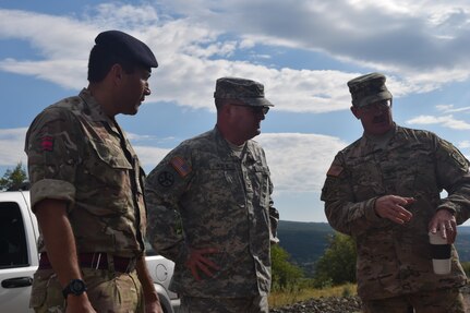 Staff Sgt. Mervin Bentley, Royal Engineer of Royal Monmouthshire, United Kingdom(UK) Army Reserves, Col. James Kyle, Medical Command, Tennessee Army National Guard, 1st. Sgt. Michael Ilko, 194th Engineer Brigade, Tennessee Army National Guard, July 5th, 2016 discuss future operations at a construction site during Resolute Castle at the Novo Selo Training Area, Bulgaria. Resolute Castle is a U.S. led effort in Eastern Europe designed to improve military infrastructure and security in the region. (U.S. Army photo by Capt. Kimberlee Lewis, 841st Engineer Battalion, U.S. Army Reserve)