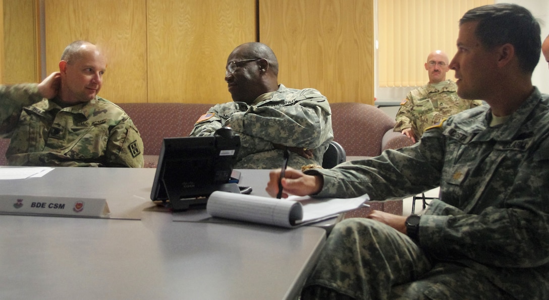 Lt. Col. Charles Bell, 1st. Sgt. Stephon McAfee and Maj. Carlos Acosta, 841st Engineer Battalion, U.S. Army Reserve, July 5th 2016, discuss the current operational posture during Resolute Castle at Novo Selo Training Area, Bulgaria. Resolute Castle is a U.S. led effort in Eastern Europe designed to improve military infrastructure and security in the region. (U.S. Army photo by Capt. Kimberlee Lewis, 841st Engineer Battalion, U.S. Army Reserve)