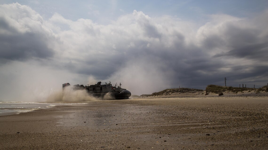 A Landing Craft Air Cushioned vehicle assigned to the USS Arlington (LPD-24), 22nd Marine Expeditionary Unit (MEU), makes its way to the beach-head during a training exercise at Marine Corps Base Camp Lejeune, N.C., April 20, 2016. The 22nd MEU worked with students from Marine Corps Combat Service Support Schools to show knowledge of real world operations. (U.S. Marine Corps photo by Sgt. James R. Skelton/Released)