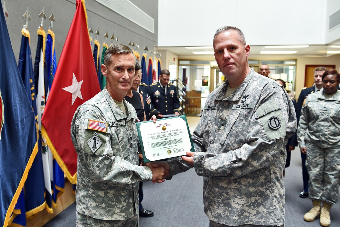 Army Reserve Col. Walter C. Catlett, left, and Brig. Gen. Frederick R. Maiocco Jr., Commanding General, 85th Support Command, pause for a photo after Catlett received a Meritorious Service Medal on July 9, 2016, for his work commanding the 2nd Mobilization Support Group. 
(U.S. Army photo by Sgt. Aaron Berogan/Released)