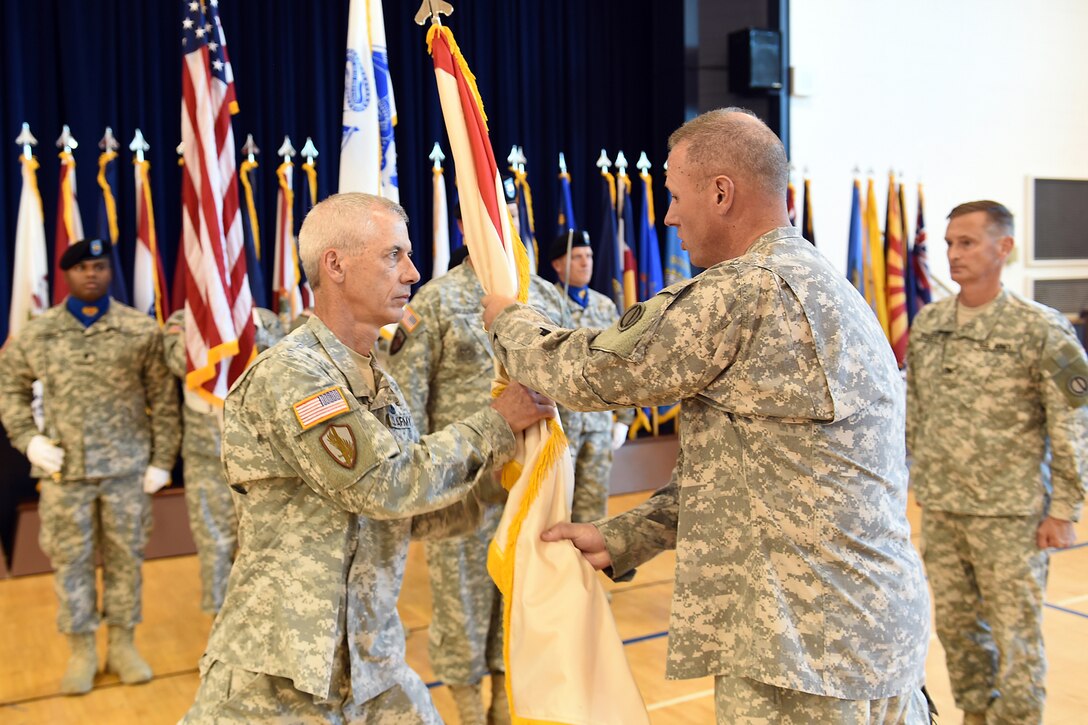 Army Reserve Brig. Gen. Frederick R. Maiocco Jr., Commanding General, 85th Support Command, passes the 2nd Mobilization Support Group flag to Lt. Col. Promotable Gary D. Curry during a change of command ceremony held in Arlington Heights, Illinois, on July 9, 2016. The passing of the flag symbolizes Maiocco’s trust and faith in Curry to successfully lead the 2nd MSG and to complete its mission.
(U.S. Army photo by Sgt. Aaron Berogan/Released)