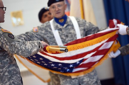 Members of the 85th Support Command color guard team roll up the American flag for safe keeping and transportation after the 2nd Mobilization Support Group, 85th Support Command’s change of command ceremony in Arlington Heights on July 9, 2016. For a majority of the members on the team, this event was their first time participating.
(U.S. Army photo by Sgt. 1st Class Anthony L. Taylor/Released)