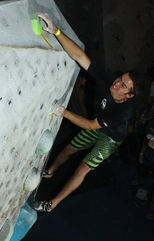 Then-civilian Michael Eckert reaches for a hold during the 2011 Aiguille Rock Climbing Competition in Orlando, Fla. Eckert has utilized the strength he’s built through almost a decade of rock climbing to set an example as a U.S. Marine. Eckert is now a sergeant stationed at Marine Corps Air Station Iwakuni, Japan, where he serves as a motor transport mechanic with Marine Wing Support Squadron 171. Courtesy photo