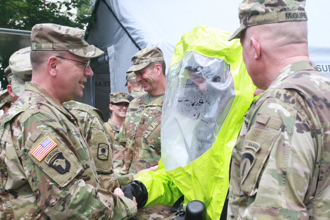 KAISERSLAUTERN, Germany- Lt. Gen. Frederick B. Hodges, commanding general U.S. Army Europe, shakes hands with a Soldier in a chemical protective suit during a visit to Daenner Kaserne on July 9, 2016. Hodges emphasized the U.S. Army and Army Reserve's strategic role in Europe against both conventional and unconventional threats. (U.S. Army photo by Sgt. Daniel J. Friedberg, 7th Mission Support Command Public Affairs Office)