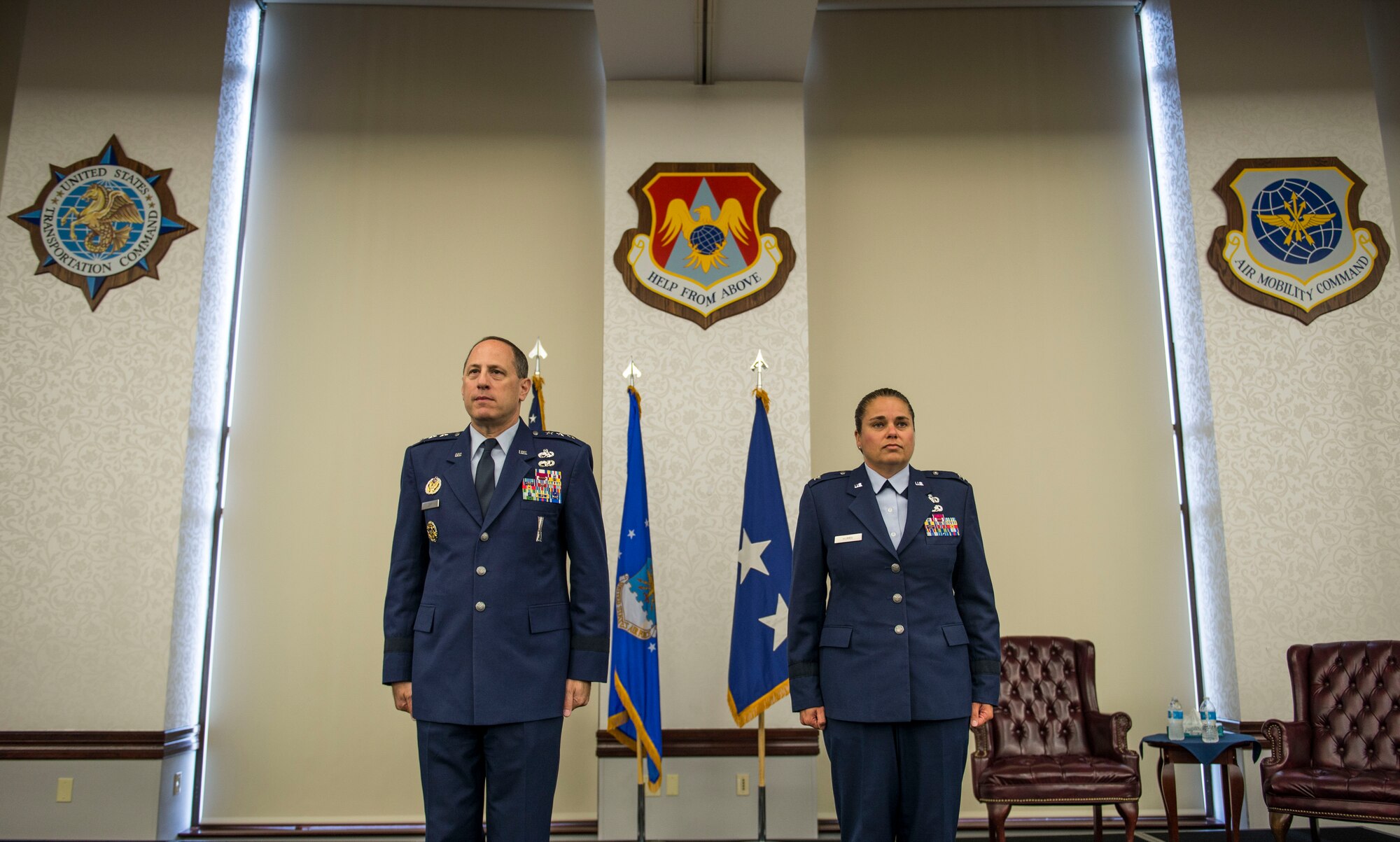 Lt. Gen. Lee K. Levy II, Air Force Sustainment Center Commander, and Brig. Gen. Linda Hurry, 635th Supply Chain Operations Wing Commander, stand at attention as the order for Hurry’s promotion is published, June 30, 2016.  Hurry stressed that her success was a team effort and gave her thanks to her mentors and the family members that attended: her two sons, Ryan and Aaron, daughter, Jordyn, parents, Hank and Sonja, brother, U.S. Army Lt. Col. Mare Washburn, and aunts, Diane and Yvonne Washburn. (U.S. Air Force photo by Staff Sgt. Jodi Martinez)