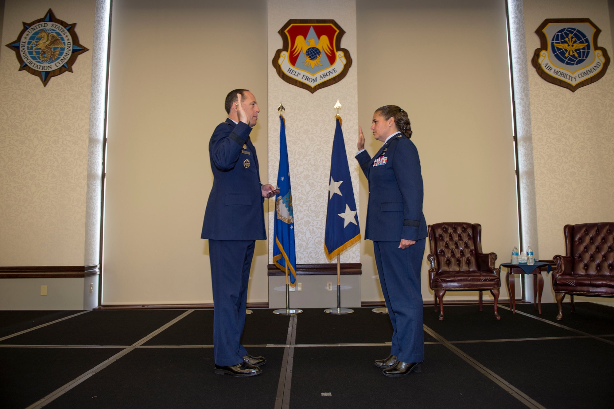Lt. Gen. Lee K. Levy II, Air Force Sustainment Center Commander, swears in Brig. Gen. Linda Hurry, 635th Supply Chain Operations Wing Commander, during her promotion ceremony, June 30, 2016.  Hurry stressed that her success was a team effort and gave her thanks to her mentors and the family members that attended: her two sons, Ryan and Aaron, daughter, Jordyn, parents, Hank and Sonja, brother, U.S. Army Lt. Col. Mare Washburn, and aunts, Diane and Yvonne Washburn. (U.S. Air Force photo by Staff Sgt. Jodi Martinez)