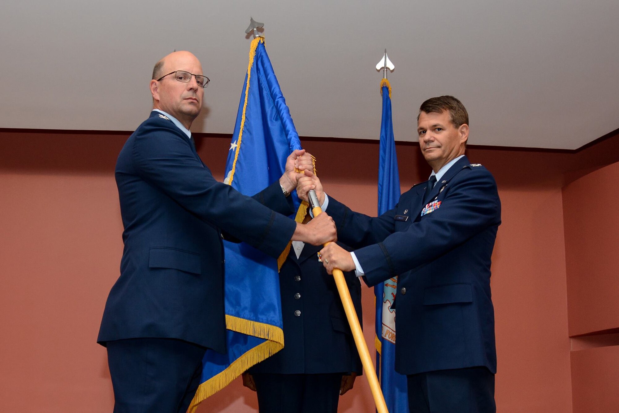 Col. John T. Langell assumes command of the 349th Medical Group during a ceremony held at the David Grant Medical Center, Travis Air Force Base July 9, 2016. Prior to assuming, Langell was commander of the 624th Aeromedical Staging Squadron, Joint Base Pearl Harbor-Hickam, Hawaii. (U.S. Air Force Photo by Senior Airman Sajjan Singh/Released)
