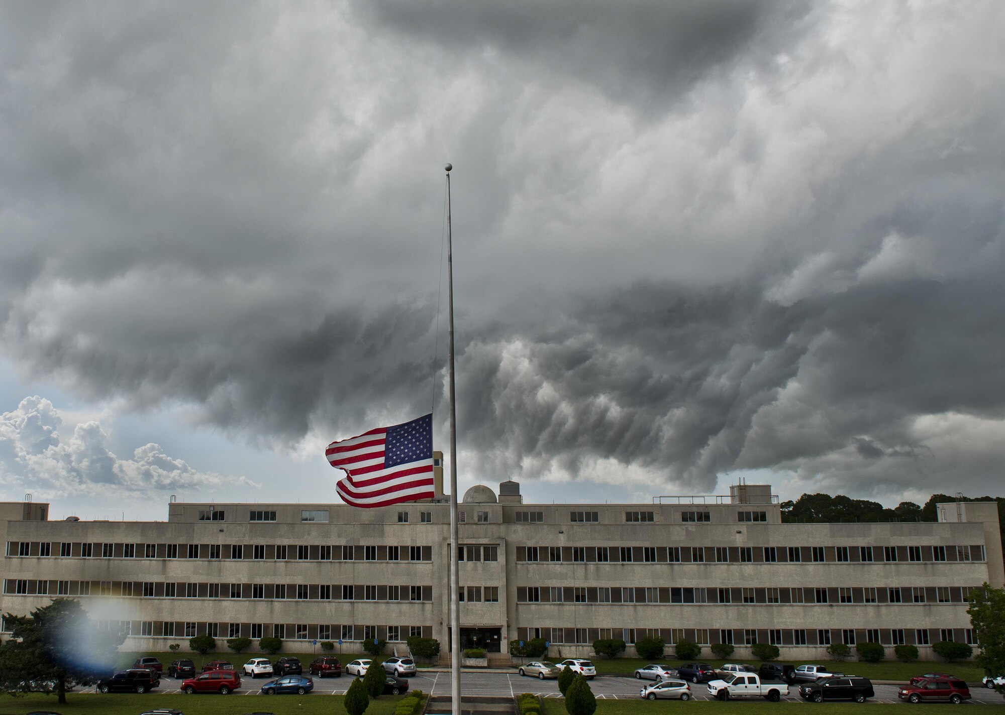 A dark storm cloud moves toward the 96th Test Wing headquarters building the morning of July 12 at Eglin Air Force Base, Fla.  The summer storm brought heavy rain, wind and lightning through the area, but was gone in less than an hour.  (U.S. Air Force photo/Samuel King Jr.)