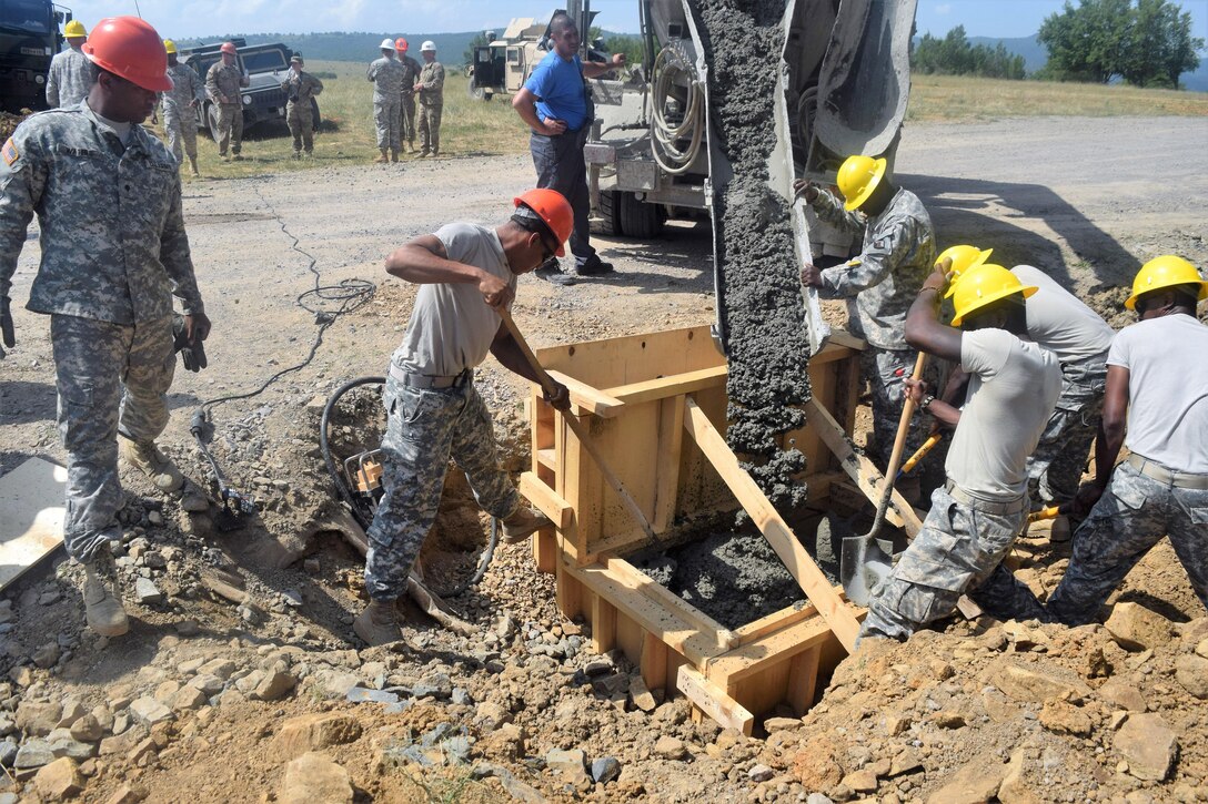 Army engineers level concrete during Operation Resolute Castle at the Novo Selo training area in Bulgaria, June 25, 2016. The soldiers are assigned to the 168th Engineer Brigade, Mississippi Army National Guard. Resolute Castle is a U.S.-led effort in Estonia, Hungary, Romania and Bulgaria focusing on military infrastructure improvement. Army National Guard photo by 1st Lt. Matthew Gilbert