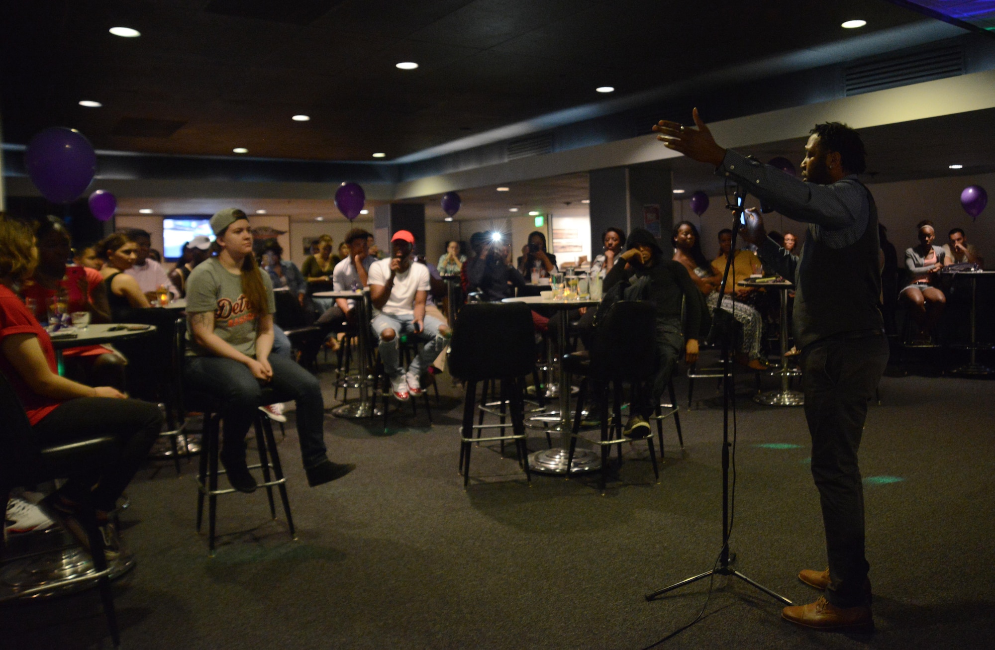 Darvis Wanton, Providence Health and Services Alaska dietary assistant, from Cleveland, Ohio, speaks at the first Spoken Word Night at the Permafrost Pub at Joint Base Elmendorf-Richardson, Alaska, July 8, 2016. The Arctic Warrior Airmen’s Council hosted this event so poets can speak their mind and inspire others in a safe environment on base. (U.S. Air Force photo by Airman 1st Class Christopher R. Morales)