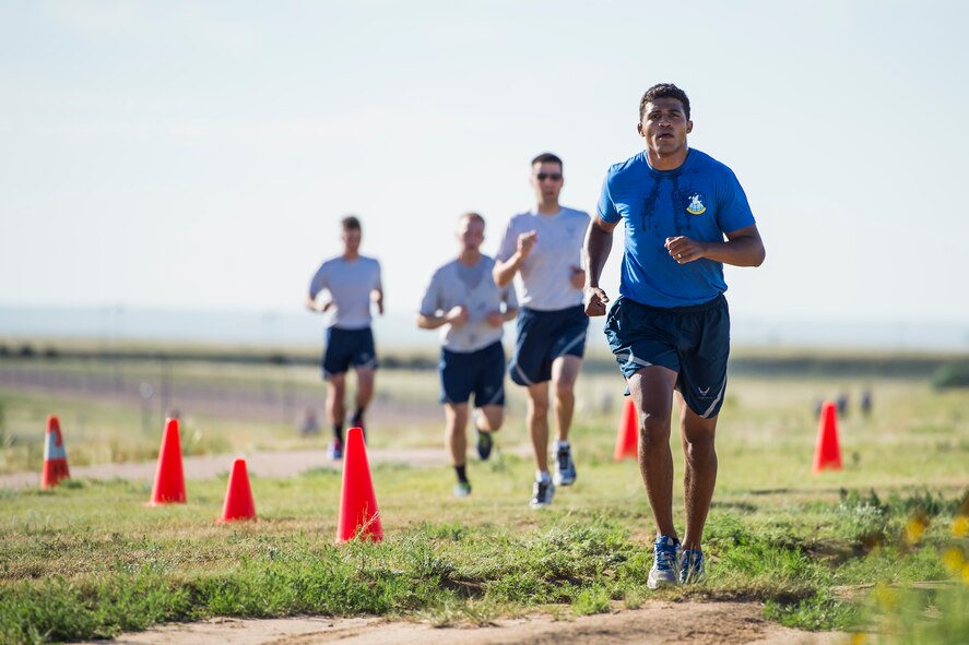 Runners approach the last stretch of the running path during the monthly Warfit Run at Schriever Air Force Base, Colorado, Wednesday, July 6, 2016. The wing holds a wing run every month from March to November. (U.S. Air Force Photo/Dennis Rogers)