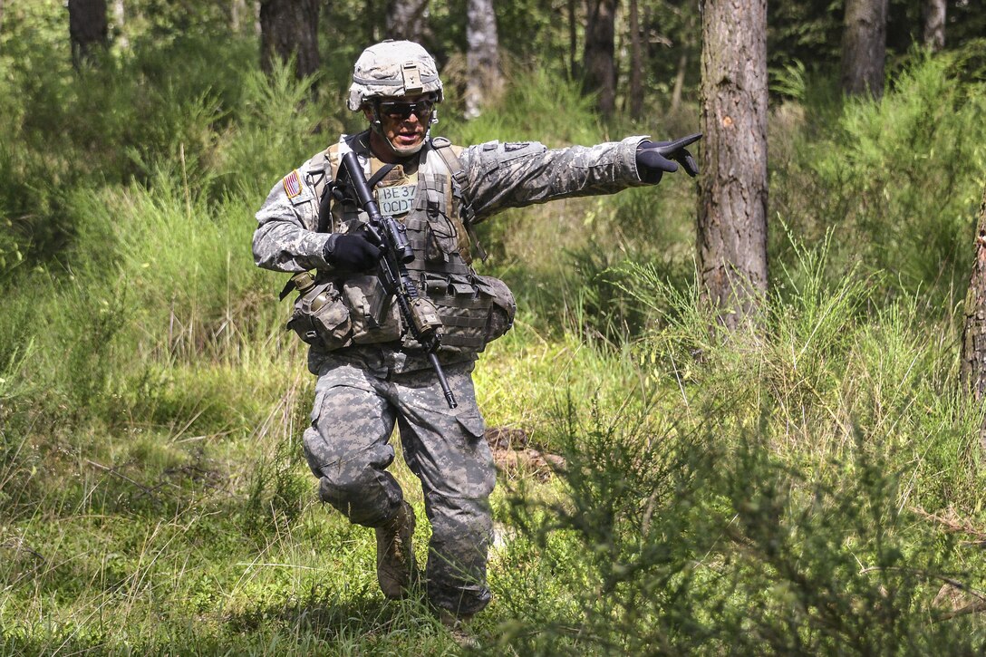 An Army cadet conducts a squad-level move as part of Exercise Dynamic Victory with British cadets at the 7th Army Joint Multinational Training Command’s Grafenwoehr Training Area, Germany, July 11, 2016. The U.S. cadet is from the U.S. Military Academy in West Point, N.Y. Army photo by Gertrud Zach
