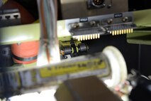 Part of the T-6A Texan II gust lock mechanism is housed behind all of the aircrafts gauges and instruments, requiring multiple parts to be displaced before beginning the gust lock removal process. Each aircraft is estimated to take three to four days to complete the project. (U.S. Air Force photo/Senior Airman Jimmie D. Pike)