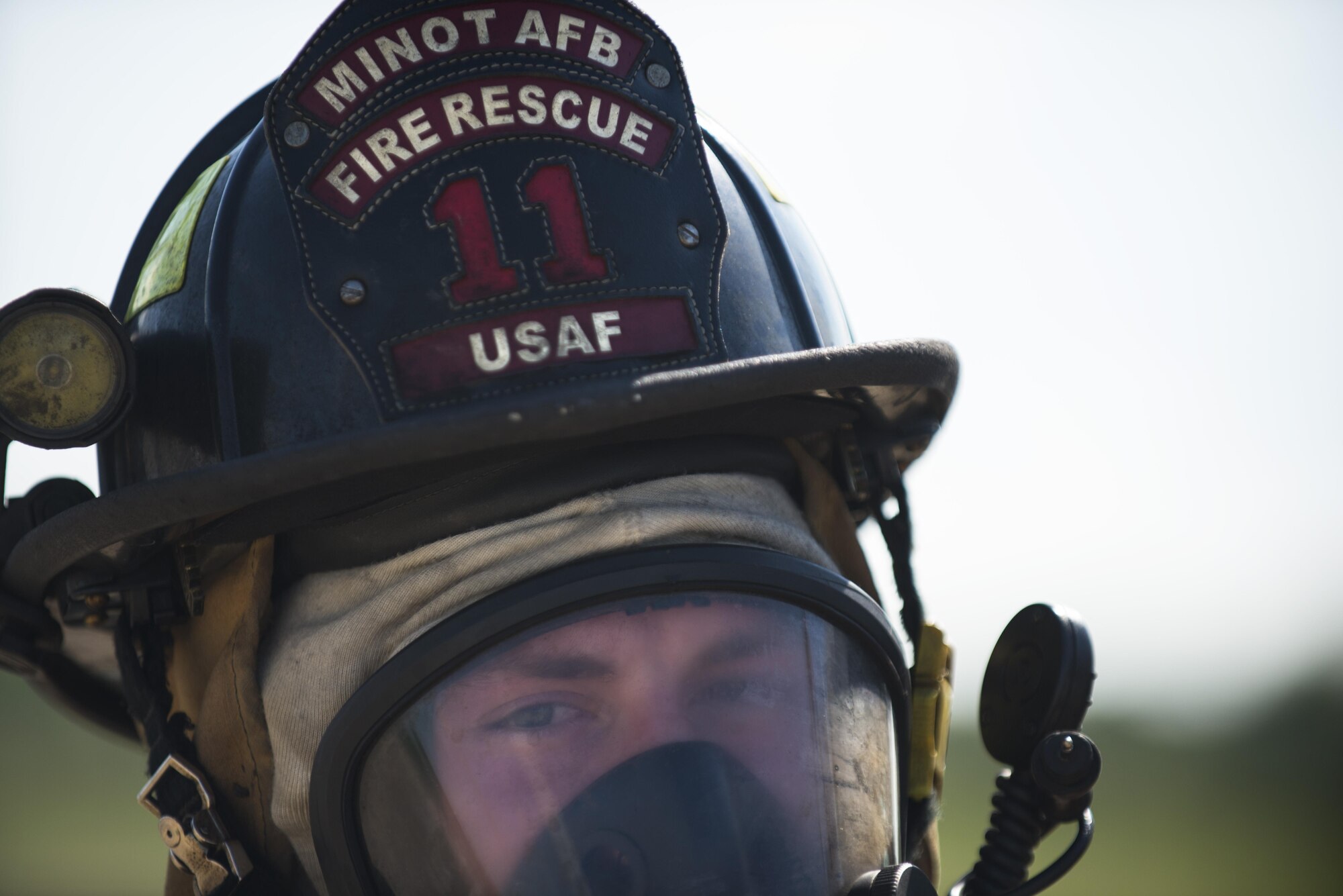 Airman 1st Class Joshua Smith, 5th Civil Engineer Squadron firefighter, puts on his firefighting gear at Minot Air Force Base, N.D., July 8, 2016. The fire protection flight’s goal is to protect MAFB’s people, property and the environment from fires and disasters by providing fire prevention, firefighting, rescue and hazardous material response. (U.S. Air Force photo/Airman 1st Class Christian Sullivan)