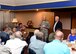 U.S. Air Force Col. Todd Hohn, 97th Air Mobility Wing commander, and Dr. Joe Leverett, 97th AMW honorary commander, brief civic leaders from Dyess Air Force Base, Texas and Goodfellow AFB, Texas about the partnership between Altus AFB, Okla., and the local community during a civic leader tour, July 7, 2016 at Club Altus. The tour was conducted to give the civic leaders from Dyess AFB and Goodfellow AFB a better understanding of how Altus AFB contributes to the mission of the U.S. Air Force. (U.S. Air Force photo by Senior Airman Franklin R. Ramos/Released)