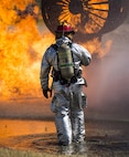 Staff Sgt. James Ratlief, 5th Civil Engineer Squadron firefighter, stares into the flames during a life fire exercise at Minot Air Force Base, N.D., July 8, 2016. The fire protection flight’s goal is to protect MAFB’s people, property and the environment from fires and disasters by providing fire prevention, firefighting, rescue and hazardous material response. (U.S. Air Force photo/Airman 1st Class Christian Sullivan)