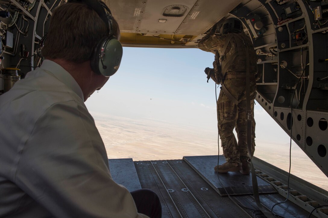 Defense Secretary Ash Carter looks out from a CH-47 Chinook helicopter over Kabul, Afghanistan, July 12, 2016. DoD photo by Marine Corps Brig. Gen. Eric Smith