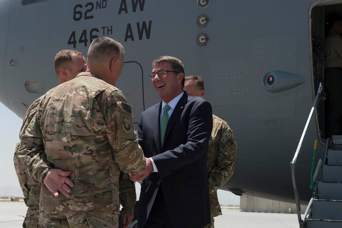 Defense Secretary Ash Carter exchanges greetings with a soldier upon arriving at Bagram Airfield, Afghanistan, July 12, 2016. Carter is in Afghanistan to meet with leaders about the Resolute Support mission. DoD photo by Navy Petty Officer 1st Class Tim D. Godbee