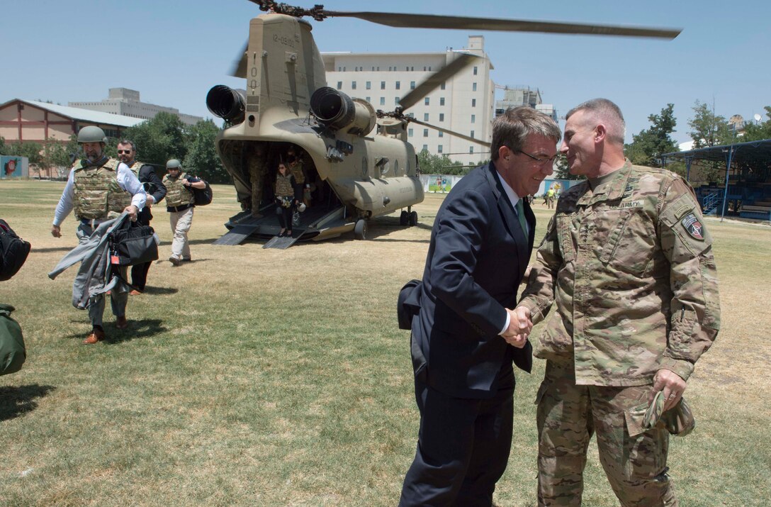 Defense Secretary Ash Carter exchanges greetings with Army Gen. John W. Nicholson, commander of the Resolute Support mission, in Kabul, Afghanistan, July 12, 2016. DoD photo by Navy Petty Officer 1st Class Tim D. Godbee