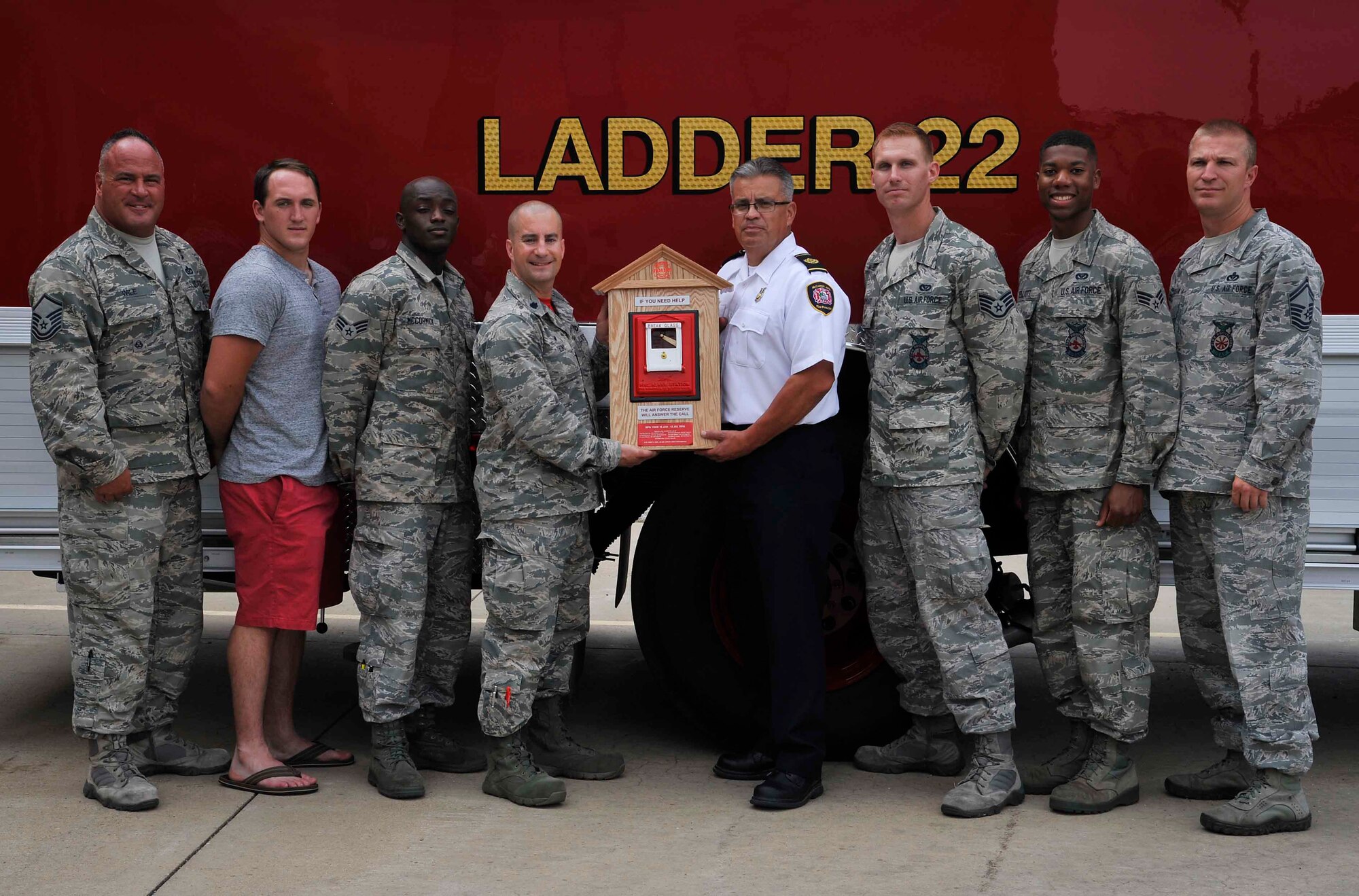 Members of the 22nd Civil Engineer Squadron pose for a photo with some of their Air Force Reserve counterparts, July 1, 2016, at McConnell Air Force Base, Kan. The reservists worked with McConnell AFB firefighters after deployments left the department undermanned. (U.S. Air Force photo/Airman Erin McClellan)