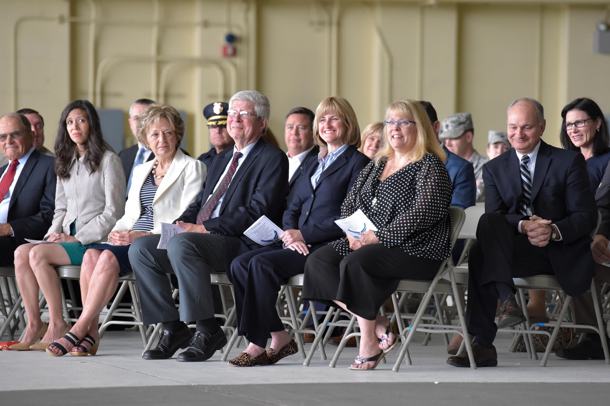 The crowd laughs politely at the 673d Air Base Wing and Joint Base Elmendorf-Richardson, Alaska, change of command ceremony at Hangar 1 on JBER, Monday, July 11, 2016. U.S. Air Force Col. Brian Bruckbauer turned over command to Air Force Col. George Dietrich III as Air Force Lt. Gen. Russell Handy, the appointed commander of Pacific Air Forces, officiated before gathered family members, distinguished guests and military personnel. (U.S. Air Force photo/Justin Connaher)
