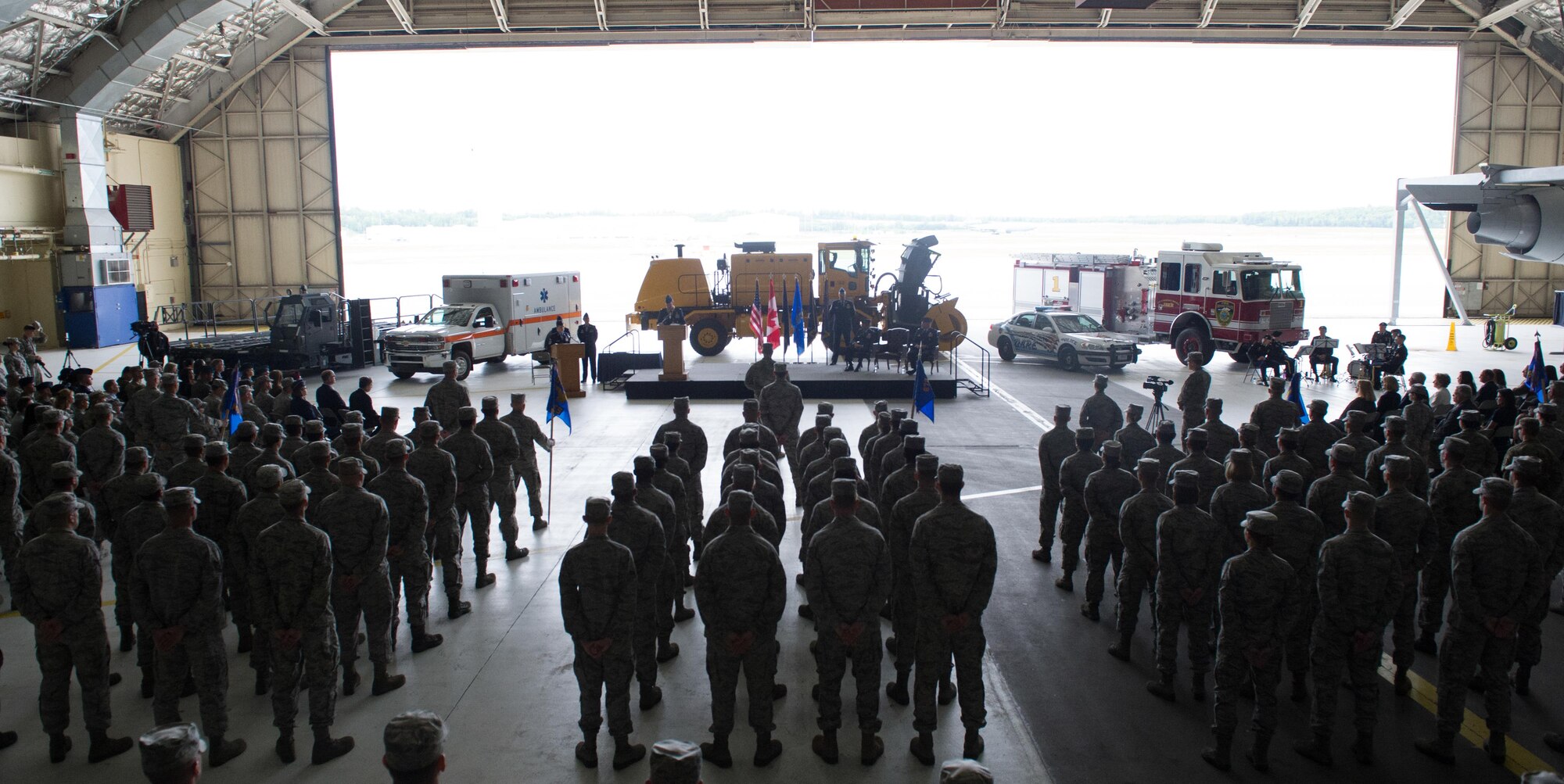The 673rd Air Base Wing and Joint Base Elmendorf-Richardson, Alaska, change of command ceremony was hosted at Hangar 1 on JBER, Monday, July 11, 2016. U.S. Air Force Col. Brian Bruckbauer turned over command to Air Force Col. George Dietrich III as Air Force Lt. Gen. Russell Handy, the appointed commander of Pacific Air Forces; Air Component Commander for the U.S. Pacific Command; and Executive Director, Pacific Air Combat Operations Staff, Joint Base Pearl Harbor-Hickam, Hawaii, as well as Alaskan Command commander, Alaskan Eleventh Air Force Commander, and Alaskan North American Aerospace Defense Command commander, officiated before gathered family members, distinguished guests and military personnel. (U.S. Air Force photo/Justin Connaher)