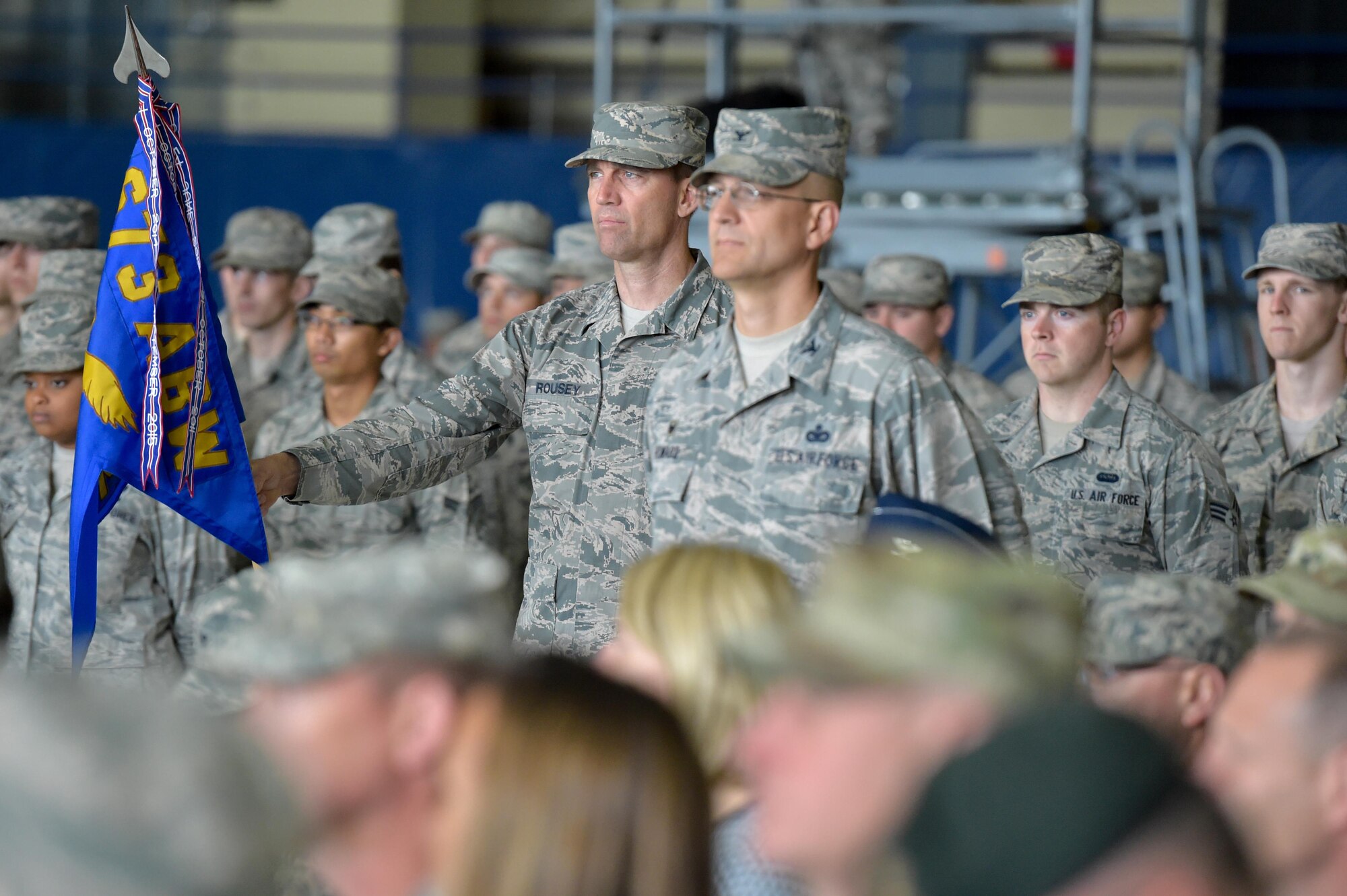Airmen stand at parade rest during the 673d Air Base Wing and Joint Base Elmendorf-Richardson, Alaska, change of command ceremony at Hangar 1 on JBER, Monday, July 11, 2016. U.S. Air Force Col. Brian Bruckbauer turned over command to Air Force Col. George Dietrich III as Air Force Lt. Gen. Russell Handy, the appointed commander of Pacific Air Forces, officiated before gathered family members, distinguished guests and military personnel. (U.S. Air Force photo/Justin Connaher)