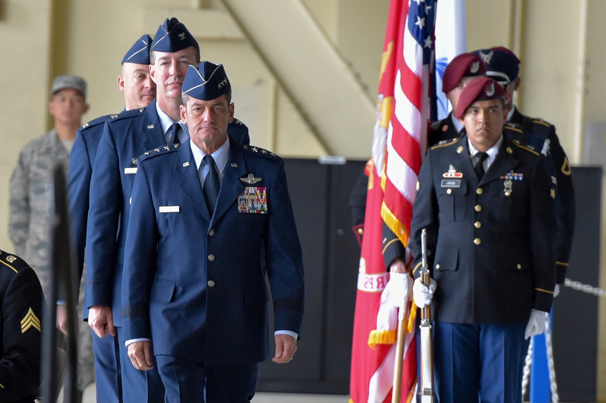 The official party enters the 673d Air Base Wing and Joint Base Elmendorf-Richardson, Alaska, change of command ceremony at Hangar 1 on JBER, Monday, July 11, 2016. U.S. Air Force Col. Brian Bruckbauer turned over command to Air Force Col. George Dietrich III as Air Force Lt. Gen. Russell Handy, the appointed commander of Pacific Air Forces, officiated before gathered family members, distinguished guests and military personnel. (U.S. Air Force photo/Justin Connaher)