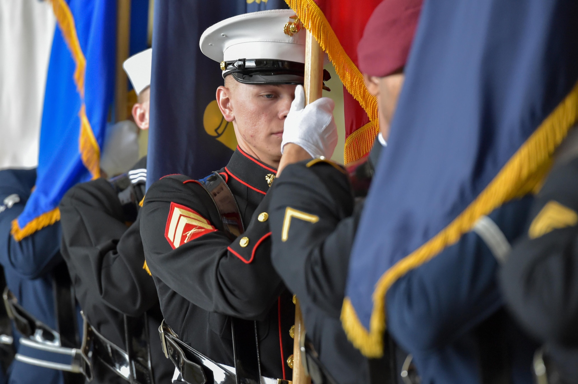 The honor guard enters the 673d Air Base Wing and Joint Base Elmendorf-Richardson, Alaska, change of command ceremony at Hangar 1 on JBER, Monday, July 11, 2016. U.S. Air Force Col. Brian Bruckbauer turned over command to Air Force Col. George Dietrich III as Air Force Lt. Gen. Russell Handy, the appointed commander of Pacific Air Forces, officiated before gathered family members, distinguished guests and military personnel. (U.S. Air Force photo/Justin Connaher)