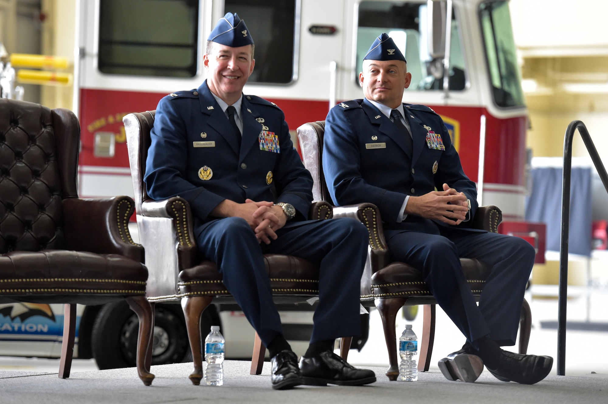Air Force Col. Brian Bruckbauer and Air Force Col. George Dietrich III listen to a speech by Air Force Lt. Gen. Russell Handy, the appointed commander of Pacific Air Forces at the 673d Air Base Wing and Joint Base Elmendorf-Richardson, Alaska, change of command ceremony at Hangar 1 on JBER, Monday, July 11, 2016. Bruckbauer turned over command to Dietrich as Handy officiated before gathered family members, distinguished guests and military personnel. (U.S. Air Force photo/Justin Connaher)