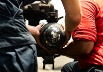 (July 12, 2016) Sailors assigned to the guided-missile cruiser USS San Jacinto (CG 56) load an AGM-114 Hellfire missile to an MH-60R Seahawk Helicopter on the flight deck of San Jacinto. San Jacinto, part of the Eisenhower Carrier Strike Group, is deployed in support of maritime security operations and theater security cooperation efforts in the U.S. 5th Fleet area of operations.            