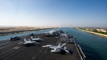 (July 8, 2016) The aircraft carrier USS Dwight D. Eisenhower (CVN 69) approaches the Friendship Bridge as it transits the Suez Canal. The Eisenhower Carrier Strike Group is deployed in support of maritime security operations and theater security cooperation efforts in the U.S. 5th Fleet area of operations.                                      