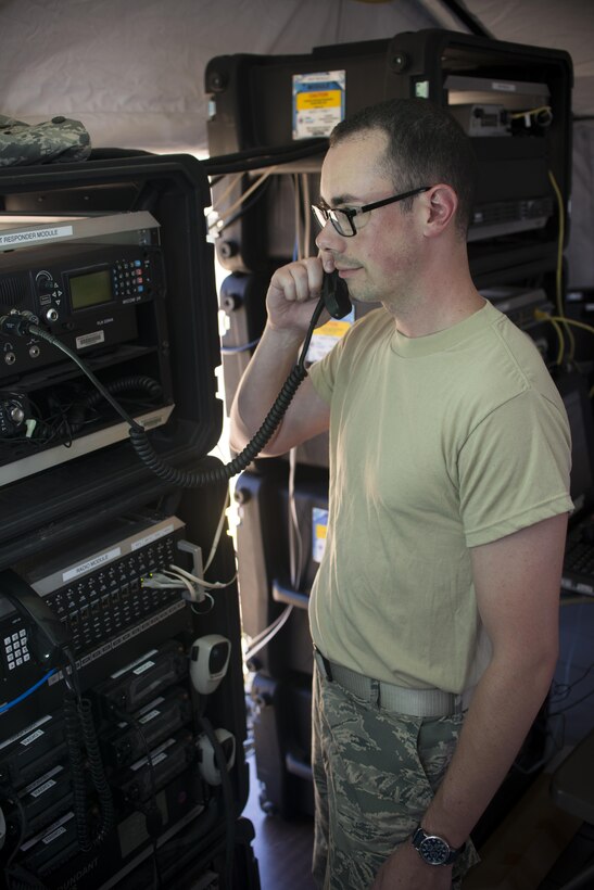 Tech. Sgt. Ryan Schmidt, Network Infrastructure Specialist, 914 Communication Squadron, tests equipment during the Air Force Reserve Command Joint Incident Site Communications Capability (JISCC) exercise, July 12, 2016, Niagara Falls Air Reserve Station, N.Y. The exercise is meant to simulate how units would deploy anywhere in the U.S. to enable inter-agency communication during a man-made or natural disaster. (U.S. Air Force photo by Tech. Sgt. Stephanie Sawyer) 