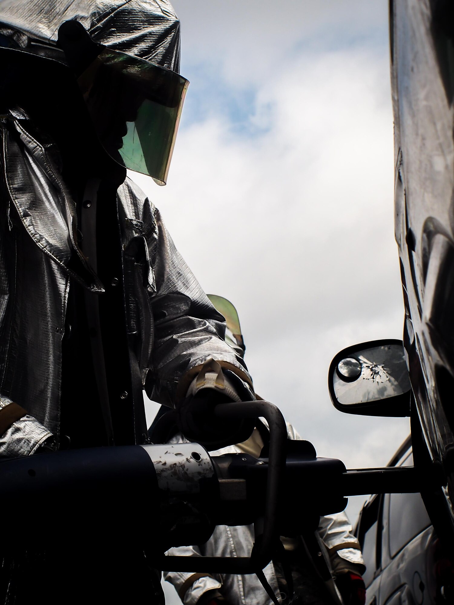 Senior Airman Savon Remo, 2nd Civil Engineer Squadron firefighter, breaks a vehicle door hinge during an accident victim extraction exercise at Barksdale Air Force Base, La., July 7, 2016.  The exercise provided Airmen with a controlled environment to identify and describe pneumatic and power auto extraction hand tools while describing patient considerations and mechanisms of injury. (U.S. Air Force photo/Senior Airman Mozer O. Da Cunha)