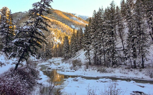 The setting sun shines on a mountain near Rainbow Basin in the Boise National Forest, Idaho, 2015. Streams and rivers between mountains are often home to trout and other small fish. (Courtesy photo by Aj Workinger/RELEASED) 