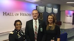 Army Col. Delisa Hernandez, director of Defense Contract Management Agency Raytheon Tewksbury in Massachusetts, and Jennifer Connell, wife of DCMA employee Ryan Connell, congratulate him on receiving a 2015 Defense Acquisition Workforce Individual Achievement and Development Award Dec. 10.