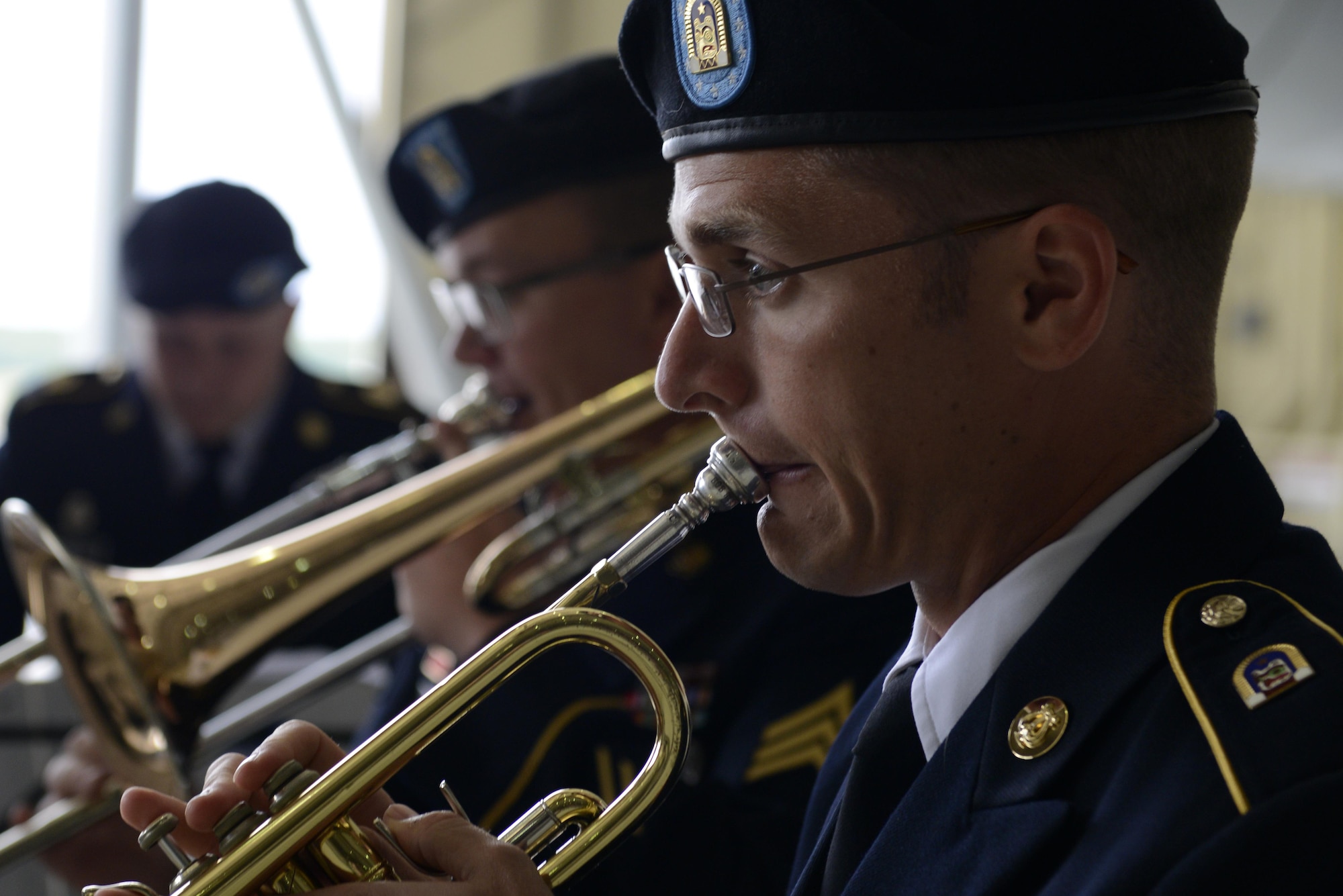 The band plays at the 673d Air Base Wing and Joint Base Elmendorf-Richardson, Alaska change of command ceremony at Hangar 1, July 11, 2016. U.S. Air Force Col. Brian Bruckbauer turned over command to Air Force Col. George Dietrich III as Air Force Lt. Gen. Russell Handy, the appointed commander of Pacific Air Forces; Air Component Commander for the U.S. Pacific Command, officiated before gathered family members, distinguished guests and military personnel. (U.S. Air Force photo by Senior Airman Kyle Johnson)