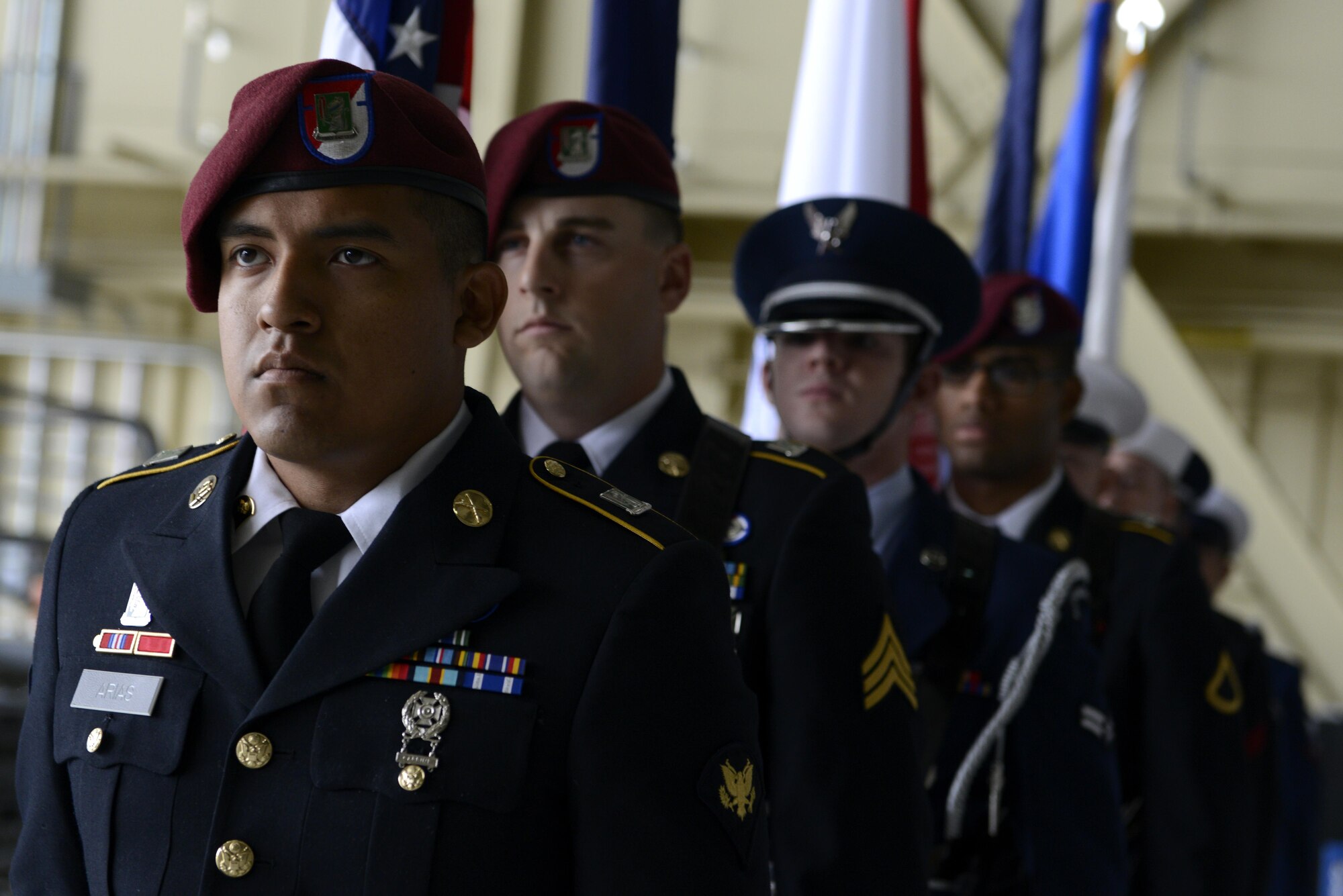 The honor guard waits for the ceremony to begin at the 673d Air Base Wing and Joint Base Elmendorf-Richardson, Alaska change of command ceremony at Hangar 1, July 11, 2016. U.S. Air Force Col. Brian Bruckbauer turned over command to Air Force Col. George Dietrich III as Air Force Lt. Gen. Russell Handy, the appointed commander of Pacific Air Forces; Air Component Commander for the U.S. Pacific Command, officiated before gathered family members, distinguished guests and military personnel. (U.S. Air Force photo by Senior Airman Kyle Johnson)