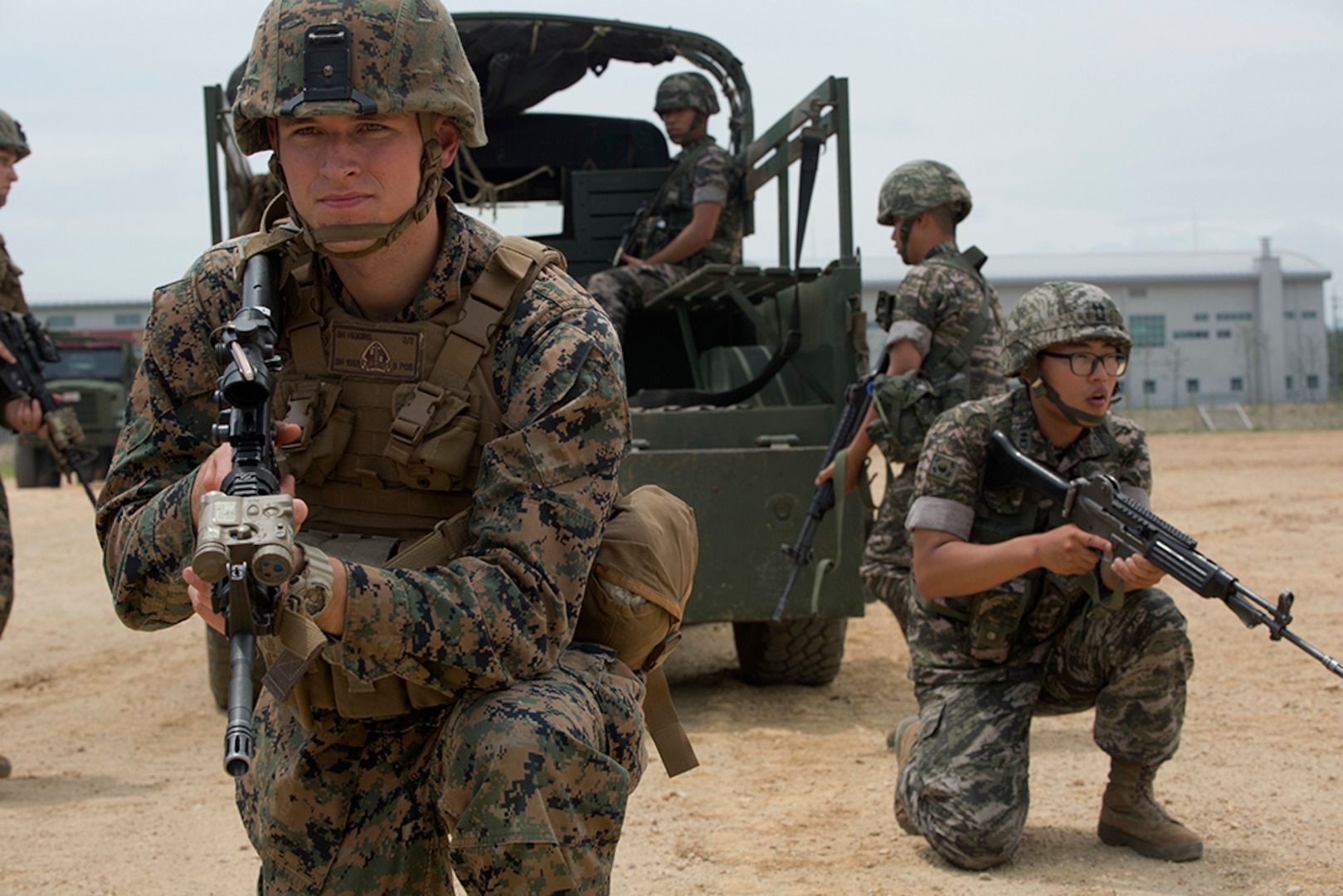 Cpl. Beau M. Higgins posts security beside a Republic of Korea Marine during convoy escort training July 11, 2016 during Korean Marine Exchange Program 16-11. KMEP offers realistic training leveraging the most advanced tactics and technology to ensure a trained and ready ROK-U.S. combined force. The ROK Marines are with 73rd Battalion, 7th Regiment, 1st Marine Division. Higgins, a Layton, Utah, native, is a cyber network specialist with 2nd Battalion, 2nd Marine Regiment, currently assigned to 4th Marine Regiment, 3rd Marine Division, III Marine Expeditionary Force through the unit deployment program.